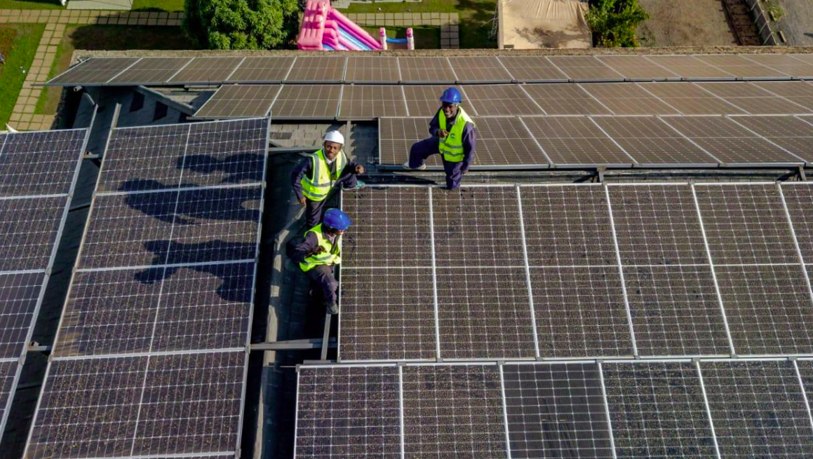 Neagle Electricals and Solar team installing solar panels on a rooftop in Kenya